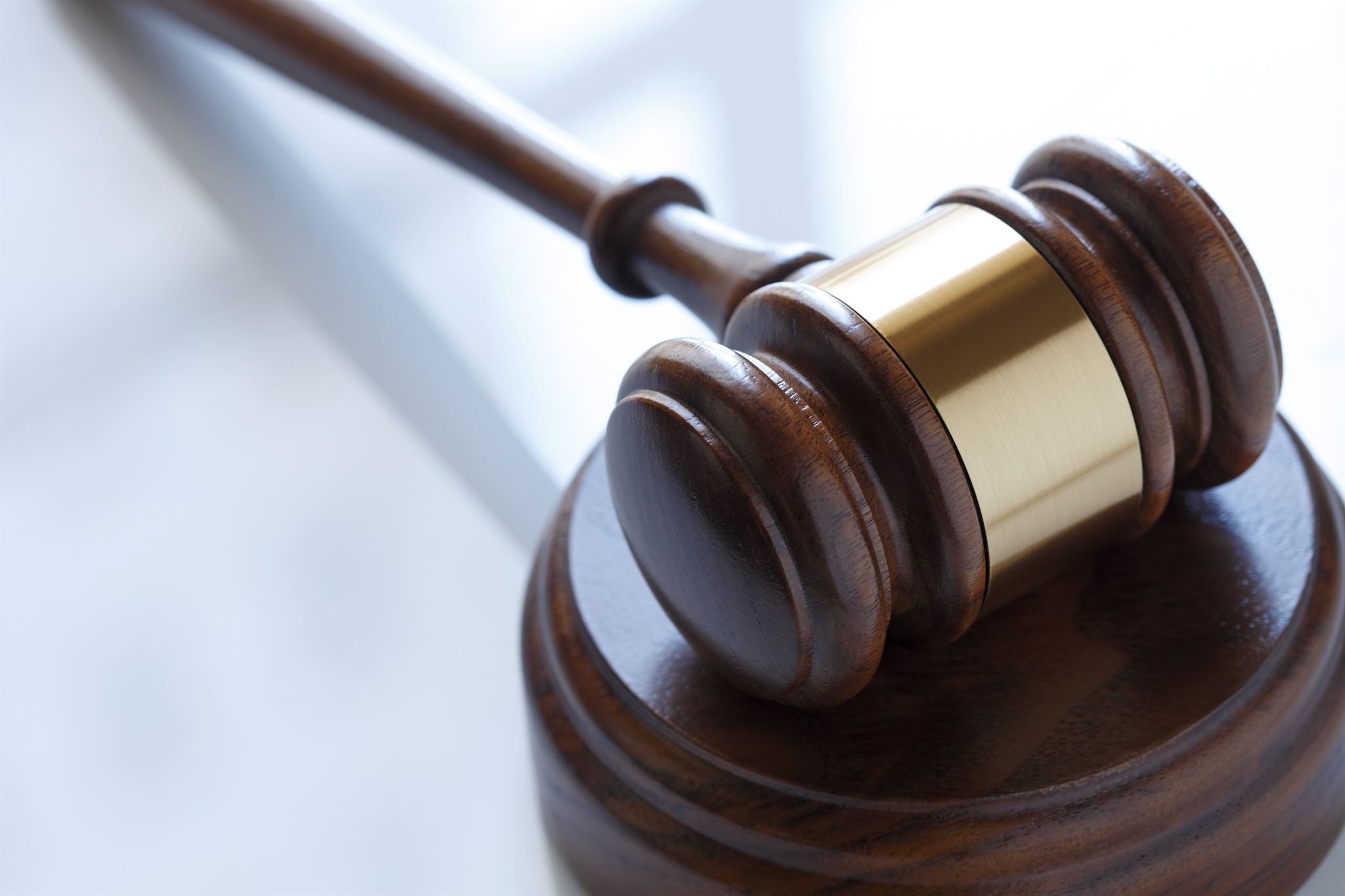 Gavel and legal books on desk